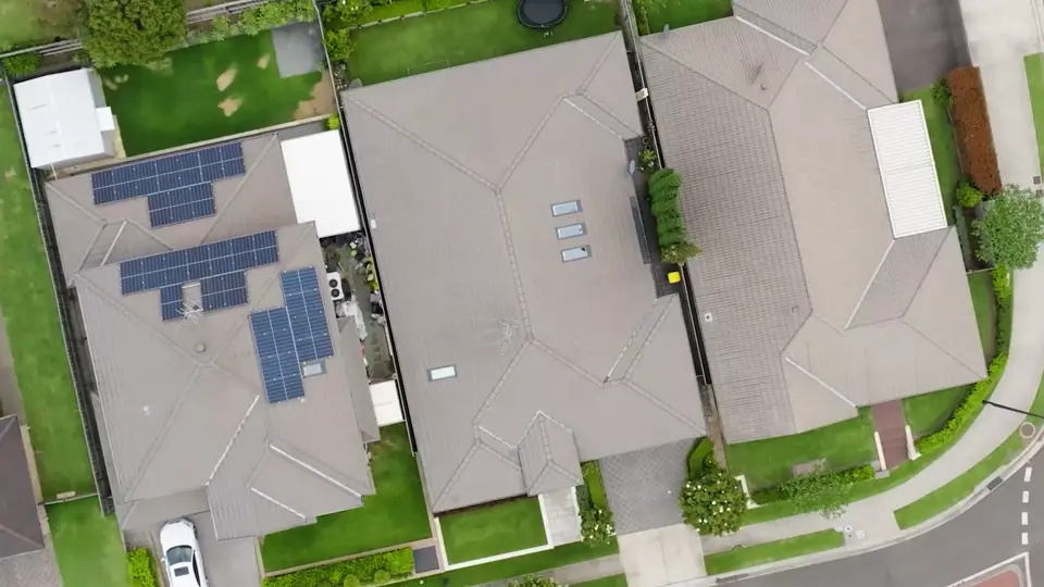 Aerial view of tiled suburban roofs prepared for professional roof painting